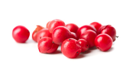 Red peppercorns on white background