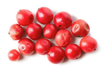 Red peppercorns on white background