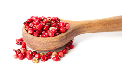 Spoon with red peppercorns on white background