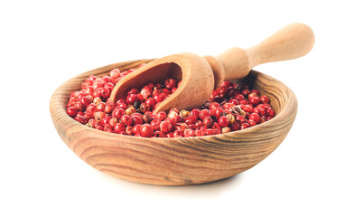 Bowl and scoop with red peppercorns on white background