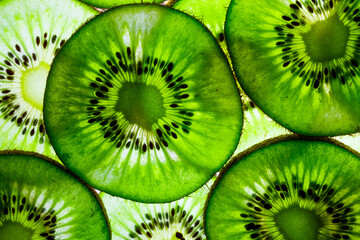 sliced kiwi fruit in round slices laid out on the table