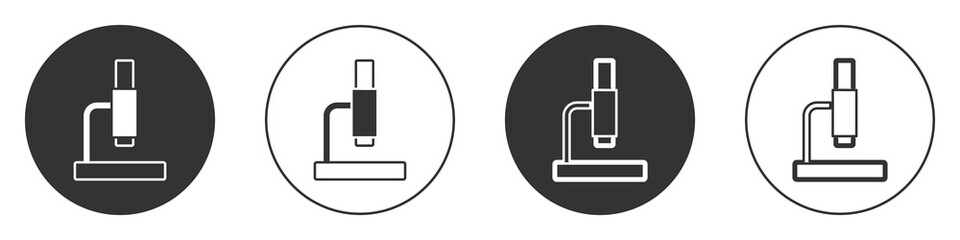 Obraz premium Black Microscope icon isolated on white background. Chemistry, pharmaceutical instrument, microbiology magnifying tool. Circle button. Vector