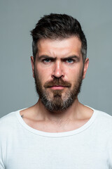 Fototapeta premium Serious man face. Bearded guy. Human expression emotion concept. Portrait of serious man.