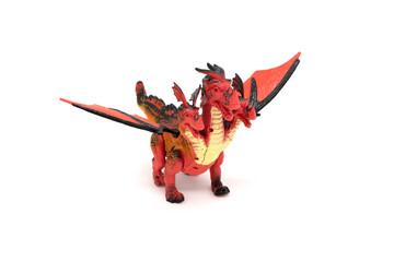 Plastic dragon toy isolated on white background.