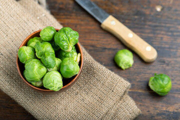 Brussels sprouts on rustic wooden table.
