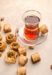 A traditional Arabic cup of Black tea and Baklawa. A popular Emirati hot beverage. Suleimani Tea - favorite Arabic black tea and dessert