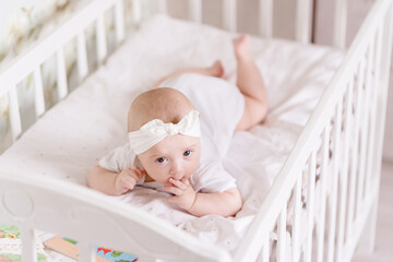little baby girl in crib
