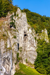 Jurassic limestone mountain massif with Glove Rock - Rekawica - in Pradnik creek valley of Cracow-Czestochowa upland in Ojcow in Lesser Poland