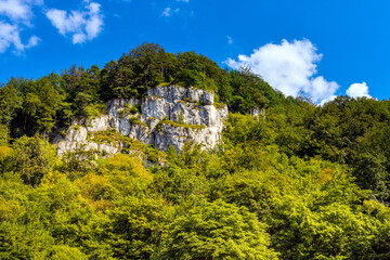 Fototapeta na wymiar Maiden Rocks - Panienskie Skaly - Jurassic limestone mountain massif in Pradnik creek valley of Cracow-Czestochowa upland in Ojcow in Lesser Poland