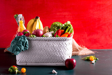 Basket with various kinds of vegetables and fruits