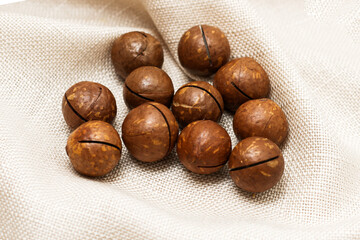 Healthy, organic inshell macadamia nuts. An expensive nut for the keto diet.