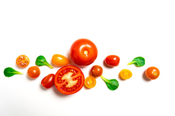 Various varieties of tomatoes on a white background