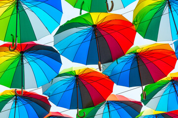 Fototapeta na wymiar Bright colored umbrellas as a background