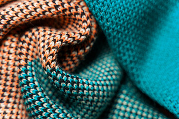 Fototapeta premium A pile of multi-colored knitted fabrics