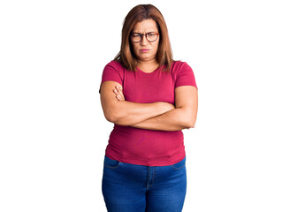 Middle age latin woman wearing casual clothes and glasses skeptic and nervous, disapproving...