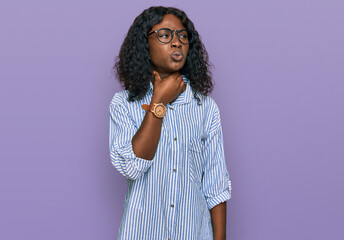 Fototapeta na wymiar Beautiful african young woman wearing casual clothes and glasses touching painful neck, sore throat for flu, clod and infection