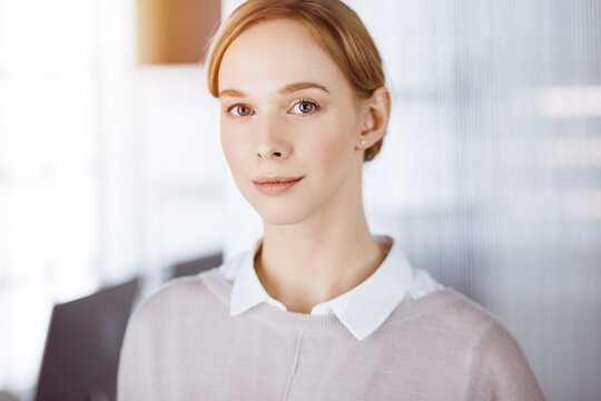 Friendly Adult Casual Dressed Business Woman Standing Straight. Business Headshot Or Portrait In Office