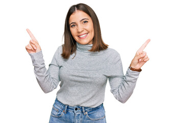 Young beautiful woman wearing casual turtleneck sweater smiling confident pointing with fingers to different directions. copy space for advertisement