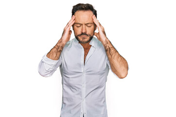 Naklejka premium Middle age man wearing casual clothes with hand on head for pain in head because stress. suffering migraine.