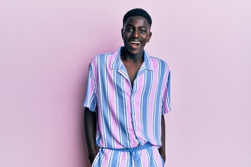 Young african american man wearing casual clothes celebrating crazy and amazed for success with open eyes screaming excited.