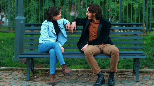 feel excluded - young man who speaks with a girl is excluded  by a friend