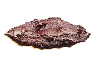 Olive (Kalamon) spread in extra virgin olive oil isolated on white background