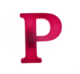 Plastic letter P on magnet isolated on white background, top view