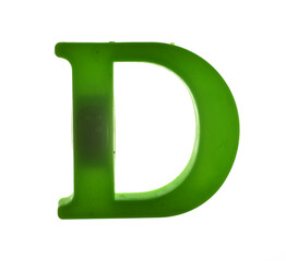 Plastic letter D on magnet isolated on white background, top view