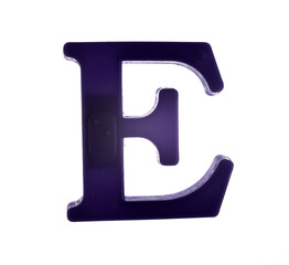 Plastic letter E on magnet isolated on white background, top view