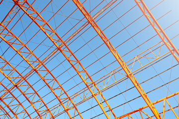 Steel structure of roof on sky background