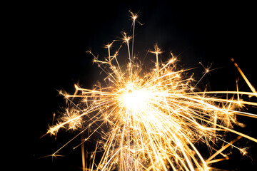 Sparkler burning with dark background. Abstract fire burning background