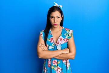 Young latin woman wearing casual clothes skeptic and nervous, disapproving expression on face with...