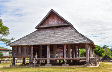 Fototapeta na wymiar An ancient wooden pavilion at Wat Phra That Ing Hang in Savannakhet, Laos.