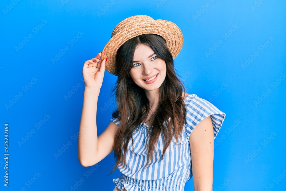 Sticker young beautiful caucasian girl wearing summer hat looking to side, relax profile pose with natural f