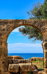 Fototapeta na wymiar The beautiful Mediterranean sea through Roman ruins arch