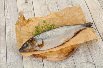 Salted herring over the wooden board