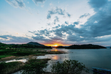 Obraz premium beautiful blue sky lake view high peak jungle mountains green river forest at Kaeng Krachan dam National Park, Phetchaburi, Thailand.