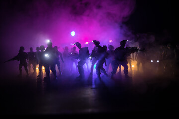 Anti-riot police give signal to be ready. Government power concept. Police in action. Smoke on a...