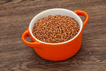 Raw buсkwheat cereal in the bowl