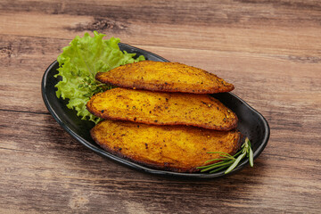 Baked potato with herbs and spices