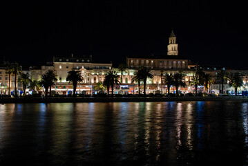 Old town of Split by night, Dalmatia, Croatia. Panorama. Palace of Diocletian, Riva promenade, Bell tower and Cathedral of Saint Domnius. 