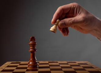 Business strategy concept. Pawn making final last step to make checkmate in chess