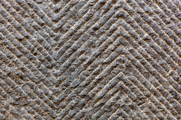 close up of a woven concrete stone floor