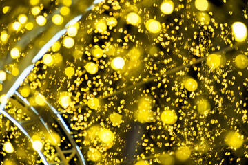 Golden Lighting and decoration item bokeh for Christmas and New Year Celebration; Blurry Abstract...
