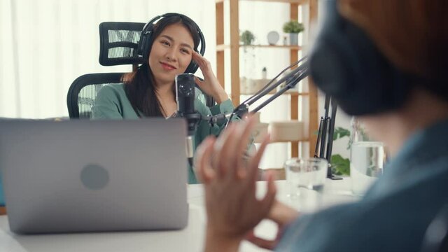 Asia Girl Radio Host Record Podcast Use Microphone Wear Headphone Interview Celebrity Guest Content Conversation Talk And Listen In Her Room. Audio Podcast From Home, Sound Equipment Concept.