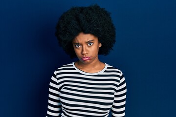 Fototapeta na wymiar Young african american woman wearing casual clothes skeptic and nervous, frowning upset because of problem. negative person.