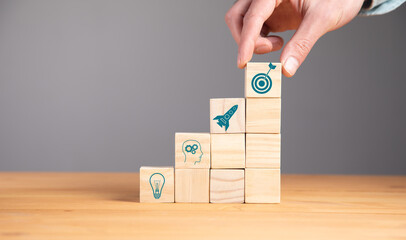 man holding target or goal on the cubes