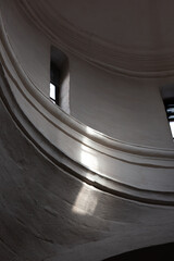 Fragment of white romanic architecture interrior with a reflection of sun