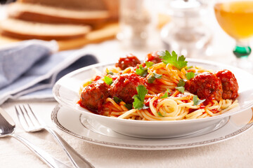 Bowl of homemade pasta with meatballs and tomato sauce