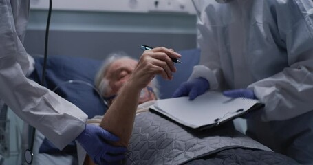 Senior man writing message to crop doctors